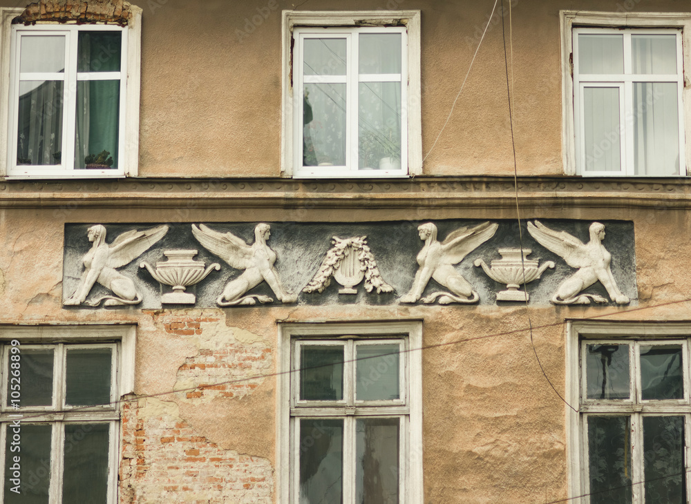 Facade with decorative stucco. Lviv, Ukraine. European travel photo.