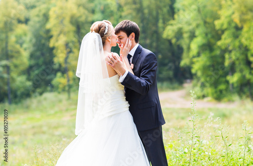 Wedding, Beautiful Romantic Bride and Groom Kissing  © satura_