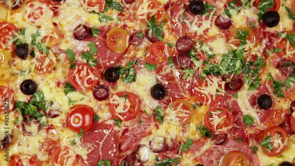 Full frame video of rotating pizza with cheese, tomatoes and olives
Full frame video of rotating pizza with cheese, tomatoes and olives