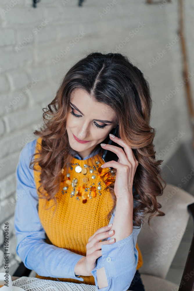 Charming lady speaking on the phone Charming lady speaking on the phone