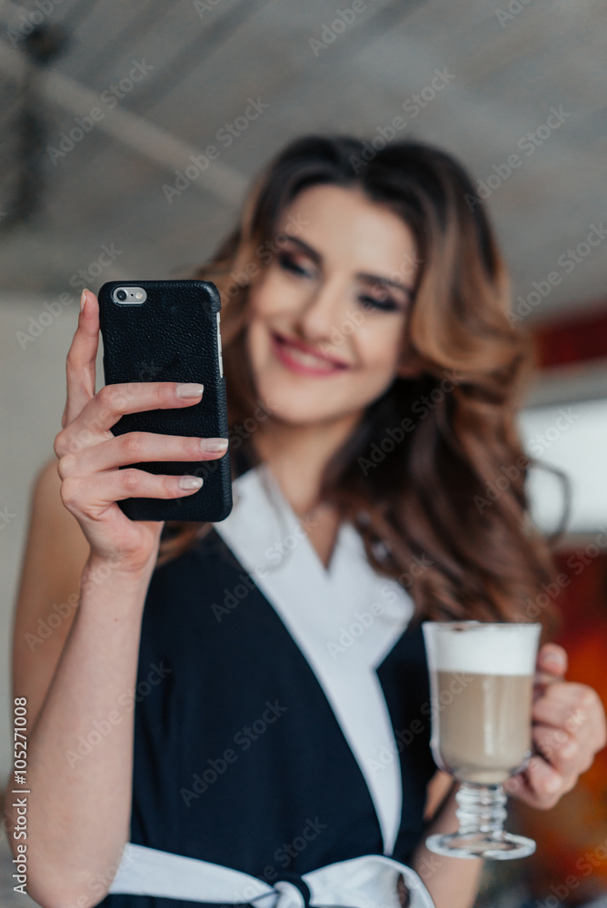 Style lady sitting at the table in cafe and smiling Style lady sitting at the table in cafe and smiling