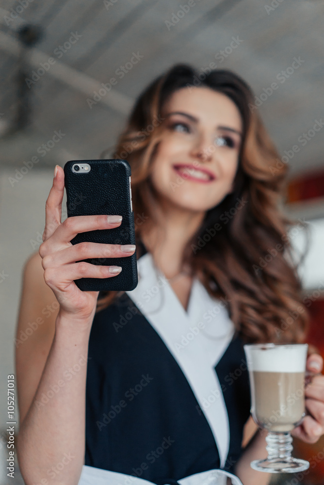 Style lady sitting at the table in cafe and smiling Style lady sitting at the table in cafe and smiling
