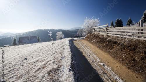 Winter dirt road on the top of the hills