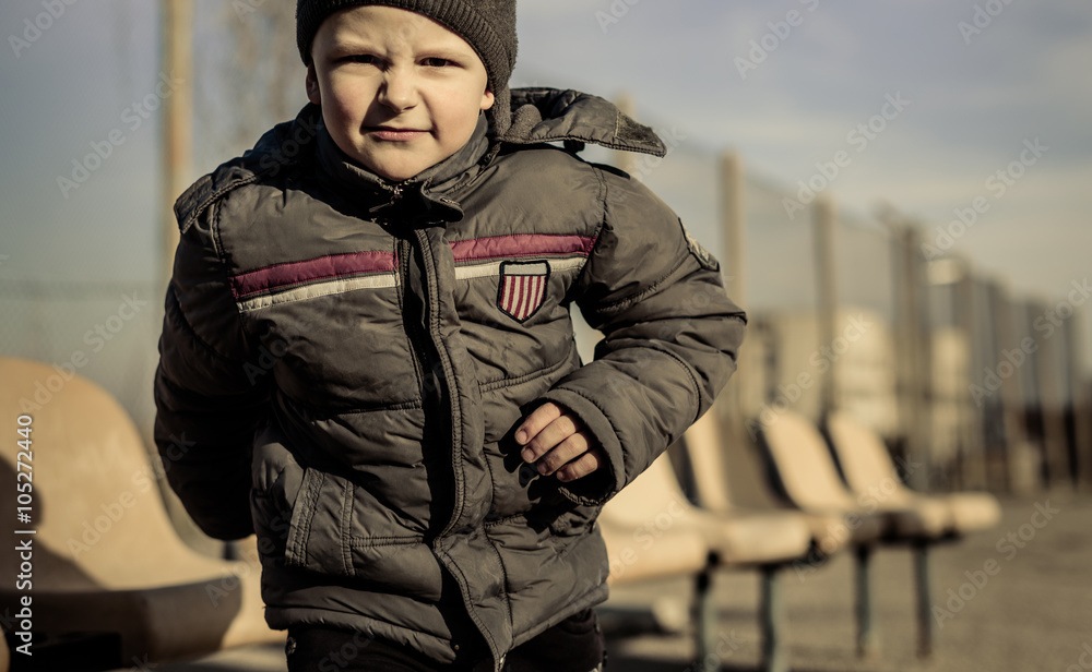 little boy playing on the sport playground little boy playing on the sport playground