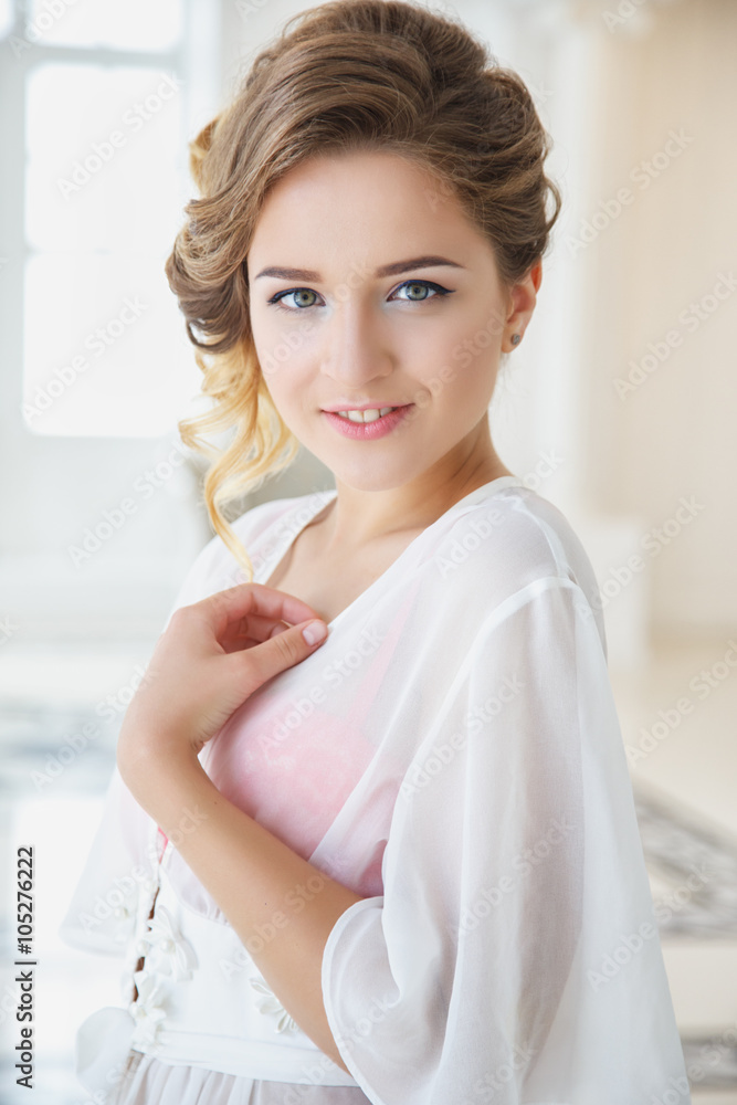 Beautiful bride in white lingerie in gorgeous interior in a morning Beautiful bride in white lingerie in gorgeous interior in a morning