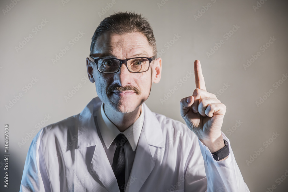 funny engineer inventor scientist looks and and raised his index finger on a white background funny engineer inventor scientist looks and and raised his index finger on a white background