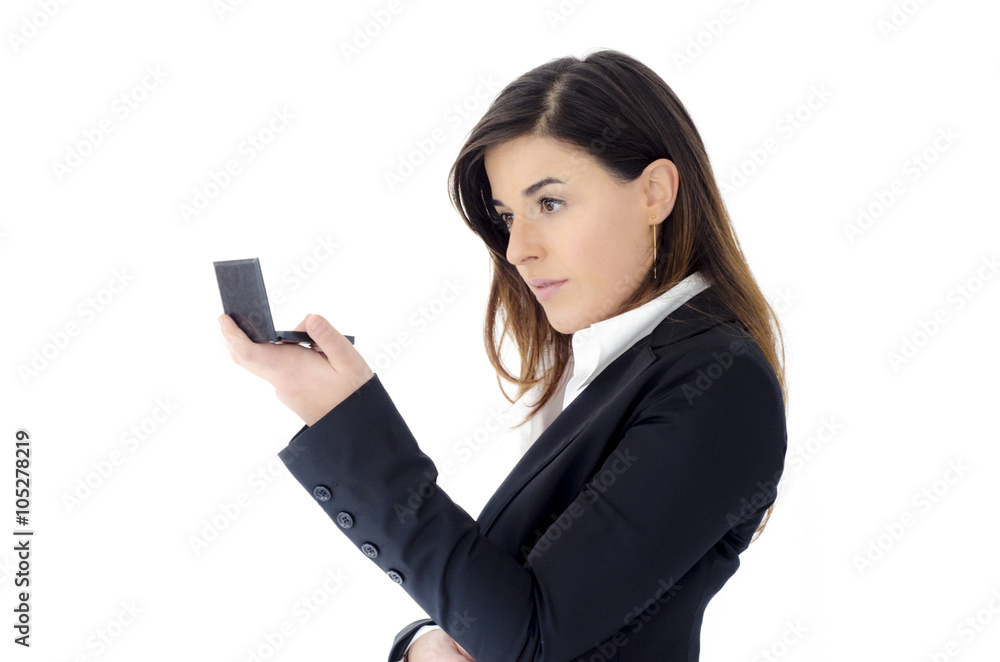 Beautiful business woman looking in the mirror in the hand, isol Beautiful business woman looking in the mirror in the hand, isol