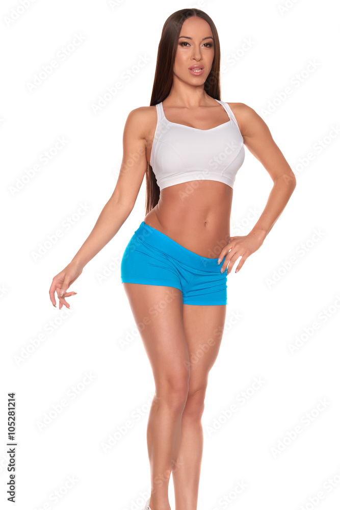Fitness woman in sport style standing against isolated white background Fitness woman in sport style standing against isolated white background
