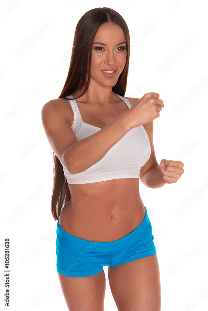 Fitness woman in sport style standing against isolated white background Fitness woman in sport style standing against isolated white background