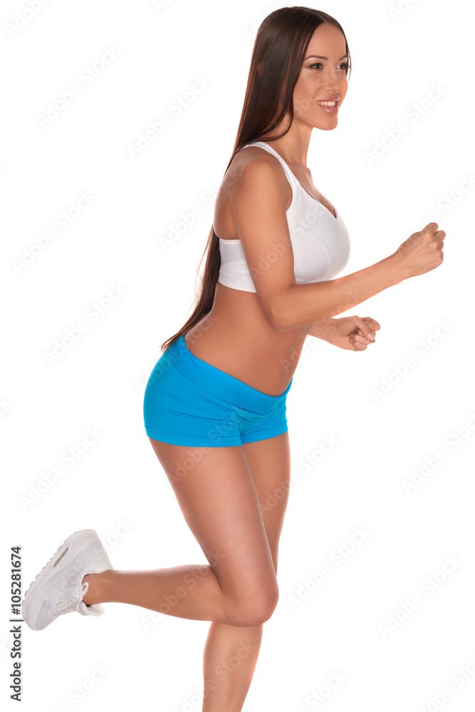 Fitness woman in sport style standing against isolated white background Fitness woman in sport style standing against isolated white background