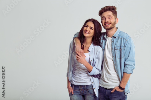 Beautiful young couple in jeans