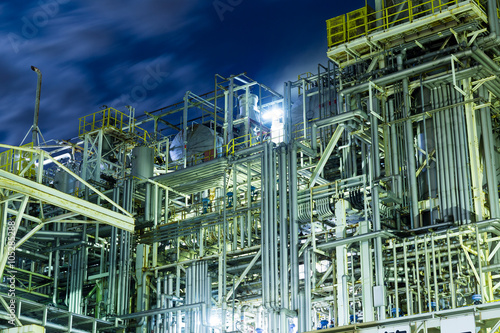 Oil and gas refinery industrial plant at night