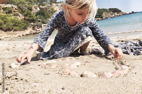 girl playing on the beach