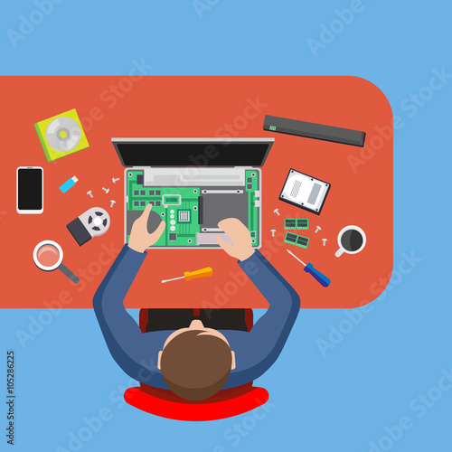 Computer service. Man repairing computer at the table, PC repair