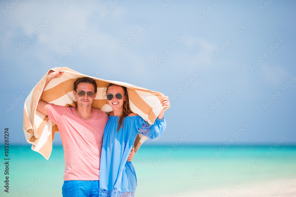 Young happy family during tropical beach vacation Young happy family during tropical beach vacation