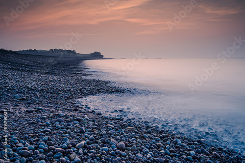 Romantic sunrise on the beach in Budleigh Salterton photo