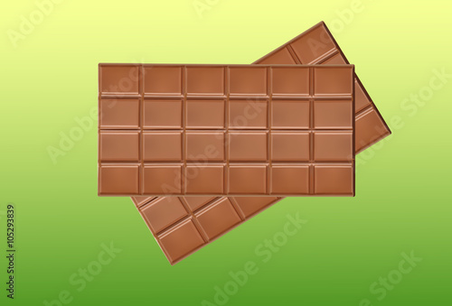 Yummy milk chocolate bar on green background