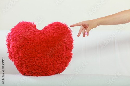 Heart shape pillow on sofa. Valentines day love.