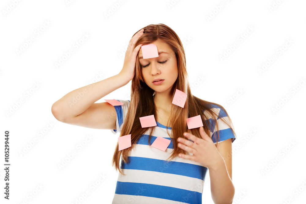 Teenage woman covered with post it notes Teenage woman covered with post it notes
