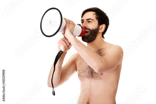Shirtless man shouting using a megaphone.