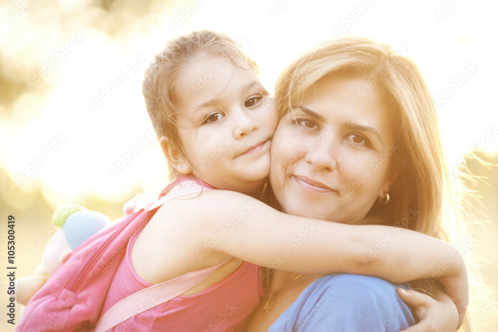 Mother and daughter embracing Mother and daughter embracing