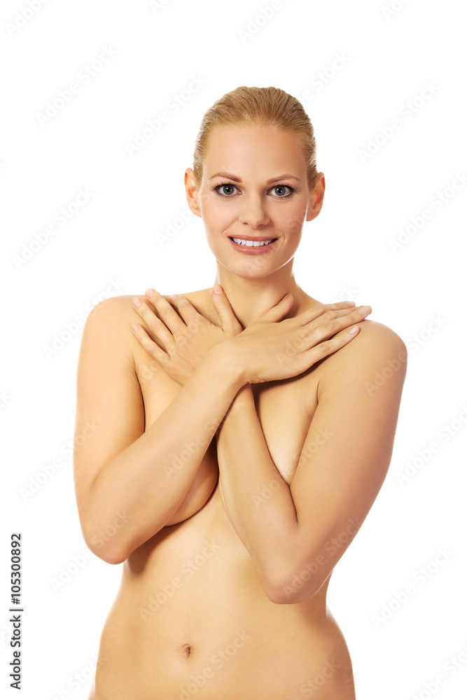 Obraz premium Beautiful topless woman covering her breast