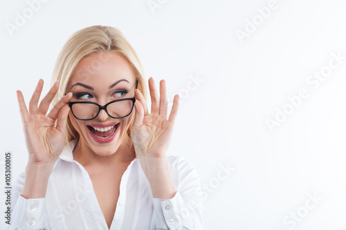 Pretty young businesswoman is expressing positive emotions