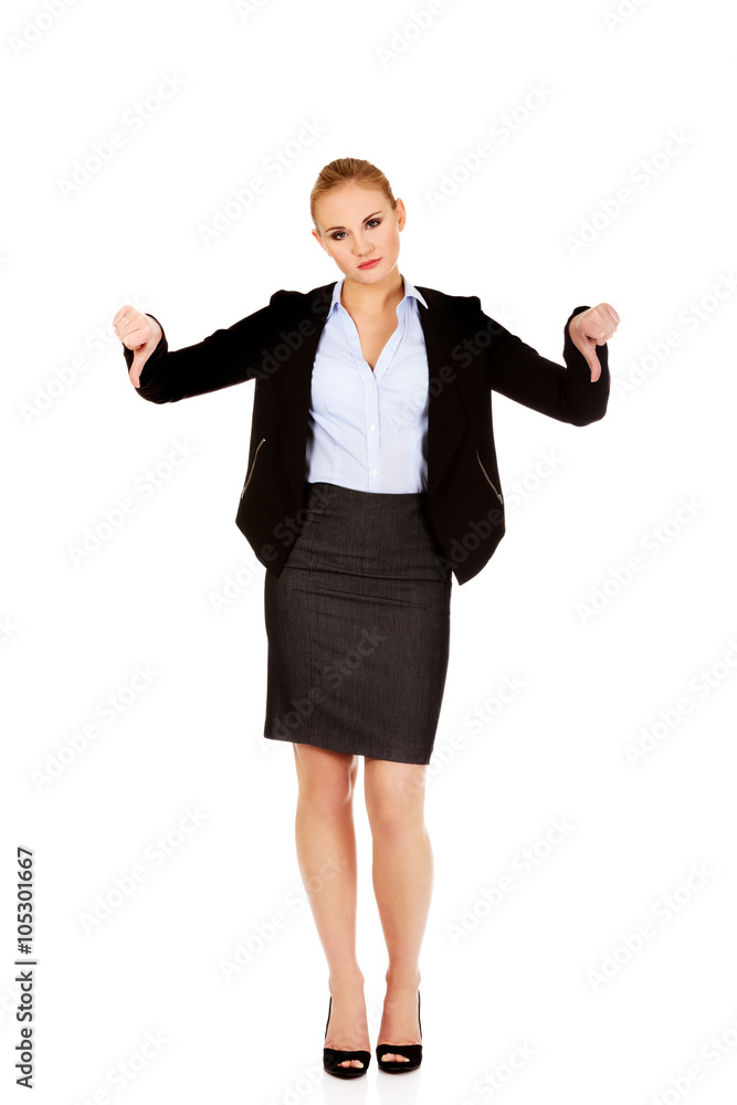Unhappy businesswoman with thumbs down gesture Unhappy businesswoman with thumbs down gesture