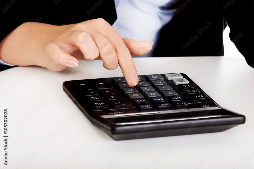 Business woman's hands counts on the calculator Business woman's hands counts on the calculator