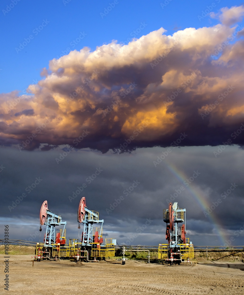 Obraz premium Rainbow and oil pumps 