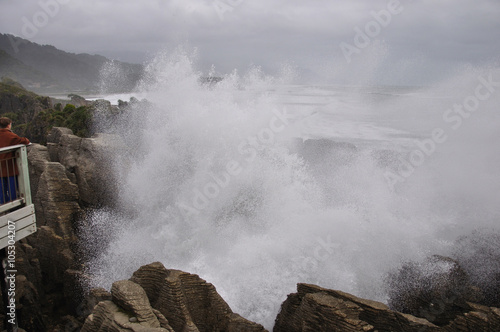 The main blowhole at Punakaiki on the West Coast of New Zealand, named Pluto, erupts with a gush of seawater at high tide.