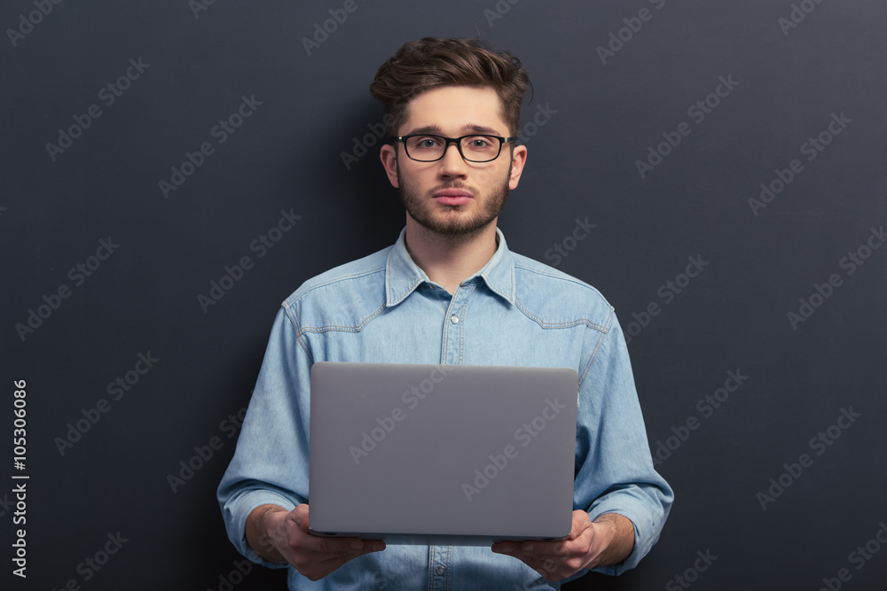Handsome student with gadget Handsome student with gadget