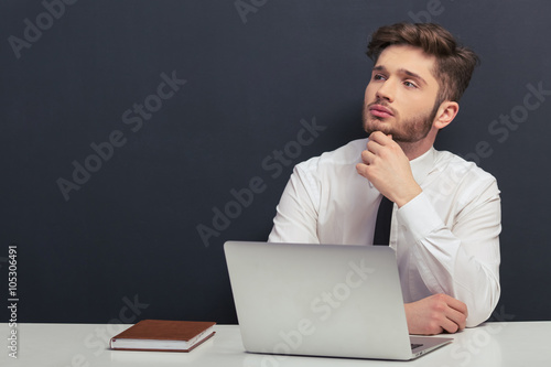 фотографія Handsome student with gadget