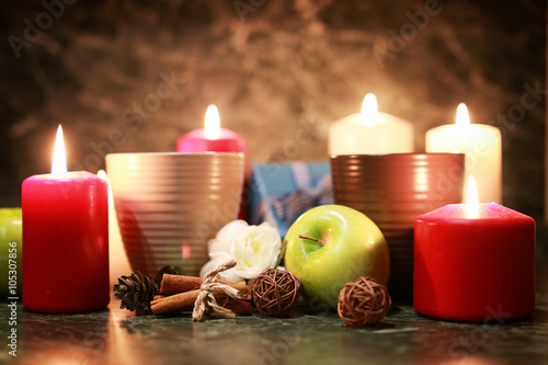 night cup of tea with candle and apple