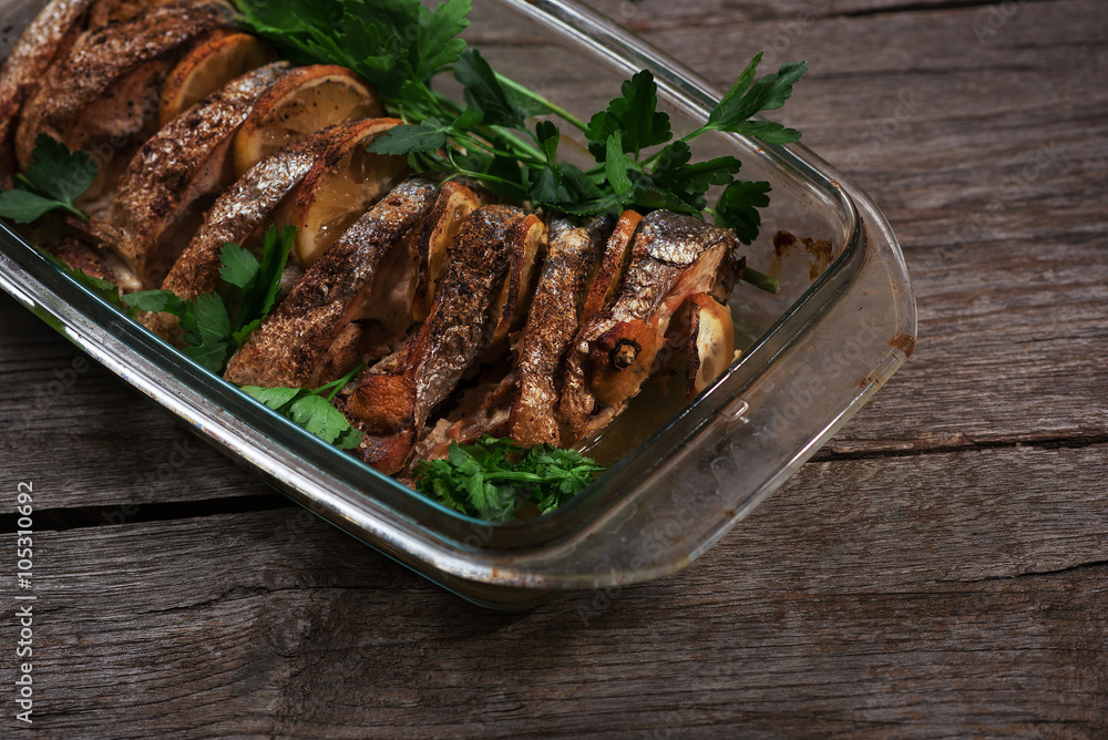 Salmon baked in the oven with lemon and fresh herbs Salmon baked in the oven with lemon and fresh herbs