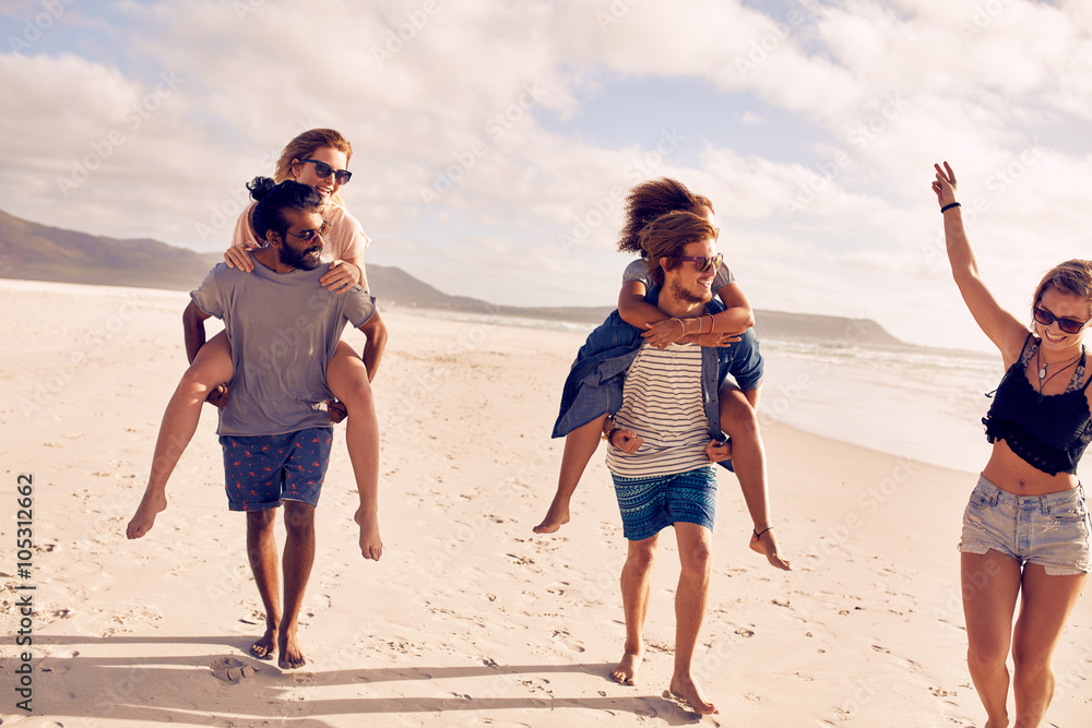 Happy young couple enjoying summer vacation on the beach Happy young couple enjoying summer vacation on the beach