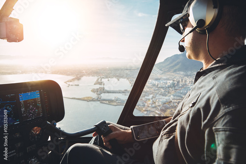 Pilot in cockpit of a helicopter