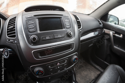 Modern car interior, dashboard with monitor and music station. Fisheye view © Kekyalyaynen