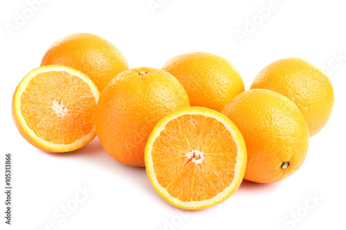 large and delicious sliced oranges laid out on a white isolated background