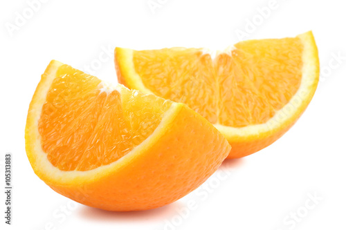 large and delicious sliced oranges laid out on a white isolated background