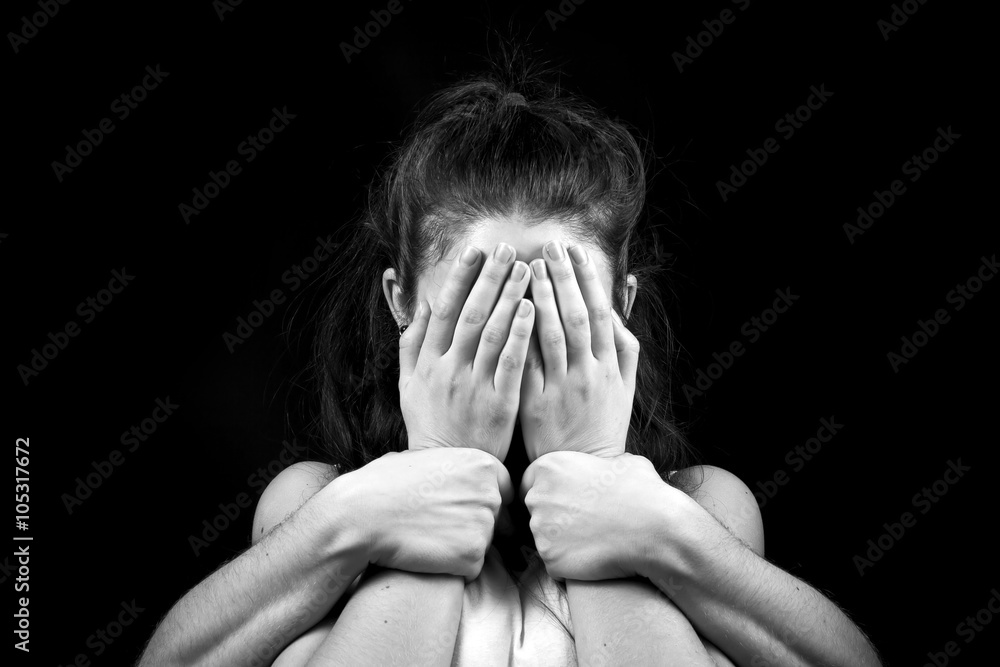 Fototapeta premium portrait of emotional young woman and lot of hands