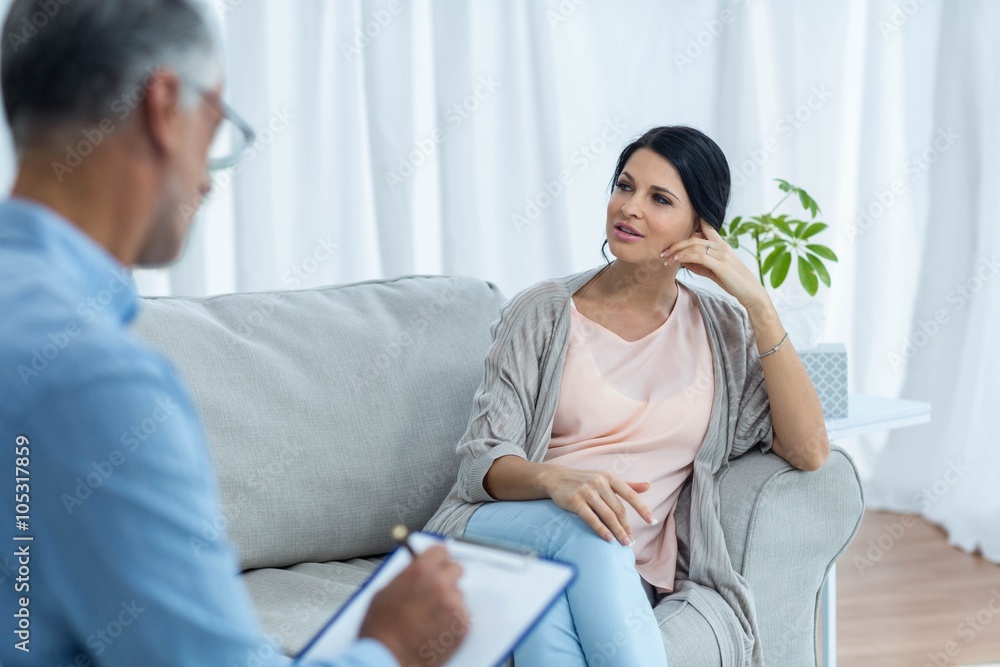 Pregnant woman talking to doctor Pregnant woman talking to doctor