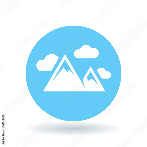 Mountain range icon. Mountains symbol. Mountain peak sign. White mountains with clouds icon on blue circle background. Vector illustration.