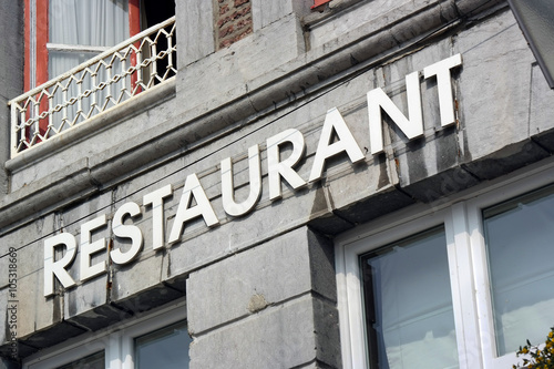 The word Restaurant at facade of old building in Wallonia, Belgium