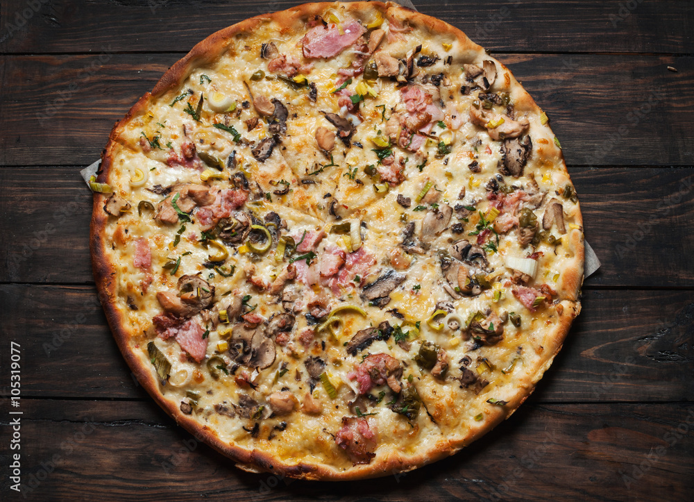 Delicious italian pizza served on wooden table Delicious italian pizza served on wooden table