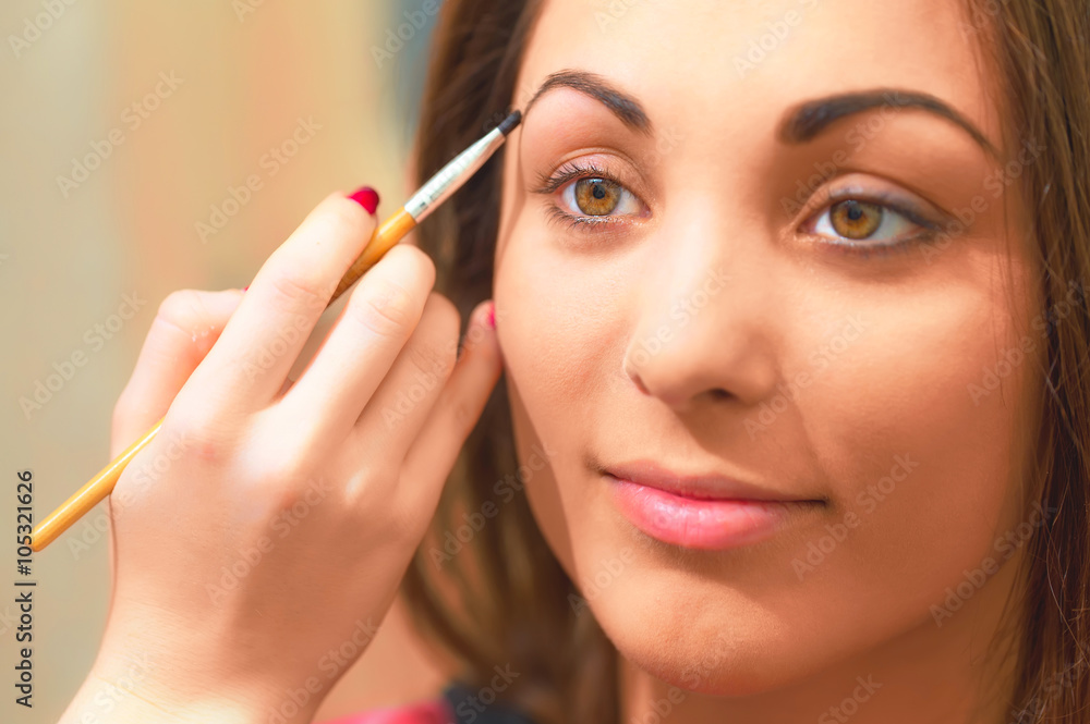 Forming eyebrow with special product and brush. Forming eyebrow with special product and brush.