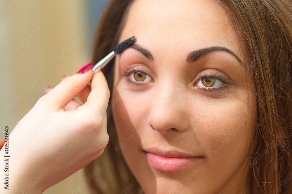 Forming eyebrow with special product and brush. Forming eyebrow with special product and brush.