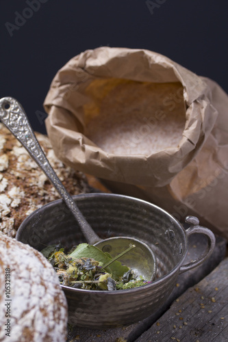 Herbs and fresh hommeade round bread . Rustic. photo