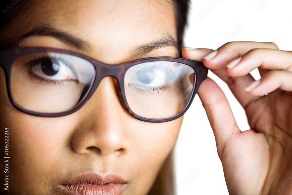 Close up view of a businesswoman holding her eyeglasses Close up view of a businesswoman holding her eyeglasses