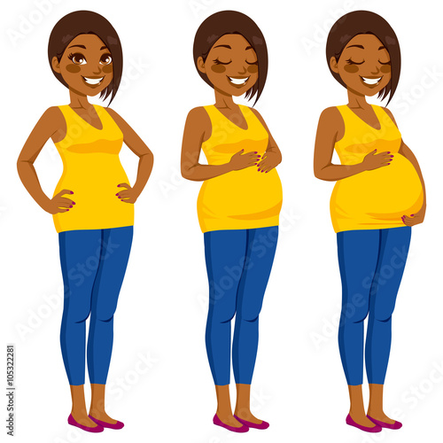 Beautiful African American pregnant woman showing pregnancy growing process touching her belly